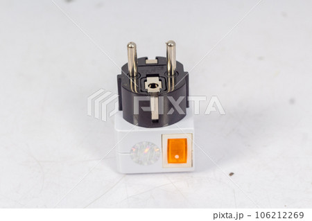 Close up of universal electric socket plug adapters, isolated on white background. Used to connect electrical outlets worldwide. Concept of solution, travel and technology. Close up of universal electric socket plug adapters, isolated on white background. Used to connect electrical outlets worldwide. Concept of solution, travel and technology. 106212269