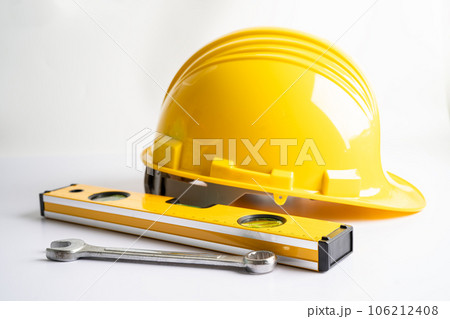 Architectural house plan project blueprint and yellow helmet with calculator, engineer construction tools. 106212408