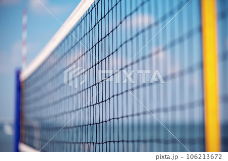 Volleyball net on the beach close-up against the blue sky 106213672