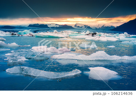 Sunset over natural iceberg in Jokulsarlon glacieer lagoon Sunset over natural iceberg in Jokulsarlon glacieer lagoon 106214636