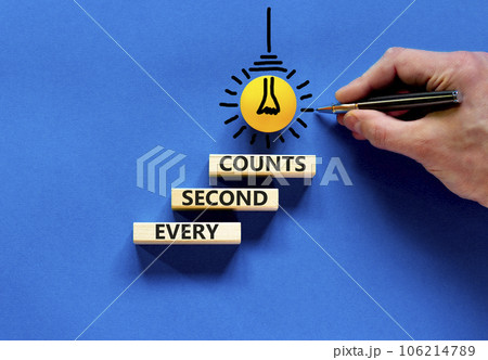 Every second counts symbol. Concept words Every second counts on wooden blocks on a beautiful blue table blue background. Businessman hand. Business, motivational and every second counts concept. Every second counts symbol. Concept words Every second counts on wooden blocks on a beautiful blue table blue background. Businessman hand. Business, motivational and every second counts concept. 106214789