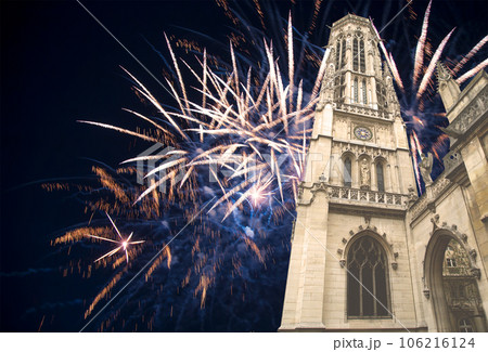 Celebratory fireworks over the Great gothic church of Saint Germain l Auxerrois, Paris, France 106216124