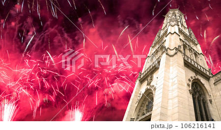 Celebratory fireworks over the Great gothic church of Saint Germain l Auxerrois, Paris, France 106216141