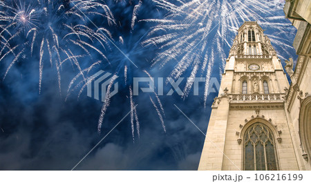 Celebratory fireworks over the Great gothic church of Saint Germain l Auxerrois, Paris, France 106216199