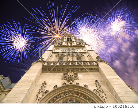 Celebratory fireworks over the Great gothic church of Saint Germain l Auxerrois, Paris, France 106216310