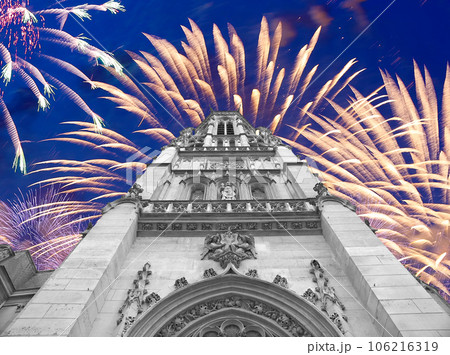 Celebratory fireworks over the Great gothic church of Saint Germain l Auxerrois, Paris, France 106216319