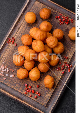Delicious fried potato balls with breaded mozzarella, salt, spices and herbs Delicious fried potato balls with breaded mozzarella, salt, spices and herbs 106217458