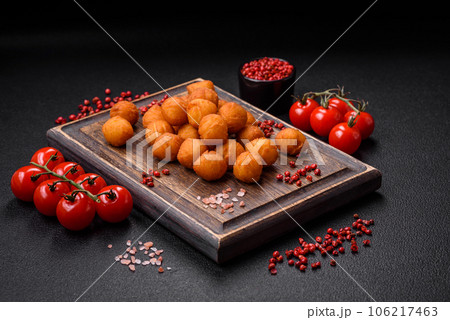 Delicious fried potato balls with breaded mozzarella, salt, spices and herbs Delicious fried potato balls with breaded mozzarella, salt, spices and herbs 106217463