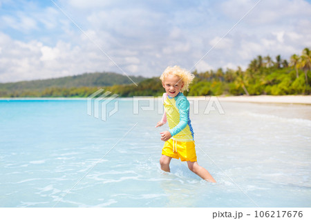 Child on tropical beach. Sea vacation with kids. Child on tropical beach. Sea vacation with kids. 106217676