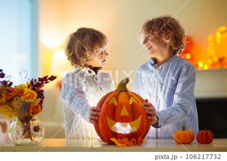 Family carving pumpkin for Halloween Family carving pumpkin for Halloween 106217732