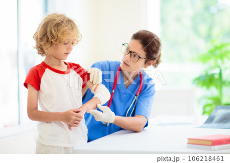 Child with arm injury. Kid with cast at clinic. Child with arm injury. Kid with cast at clinic. 106218461
