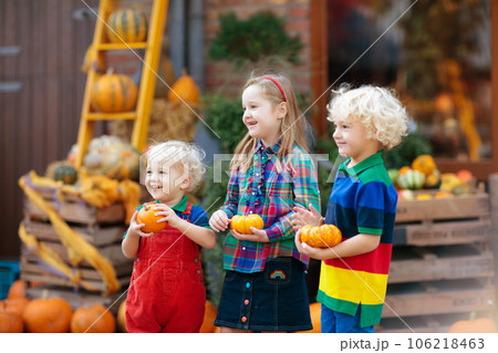 Kids having fun at pumpkin patch Kids having fun at pumpkin patch 106218463