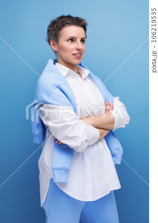 stylish young brunette woman with short haircut in white shirt stylish young brunette woman with short haircut in white shirt 106219535