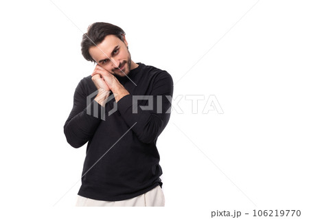 young 30 year old charming informal man with dark hair and beard posing on white studio background young 30 year old charming informal man with dark hair and beard posing on white studio background 106219770