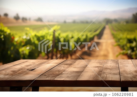 The empty wooden table top with blur background of vineyard. Exuberant. 106220981