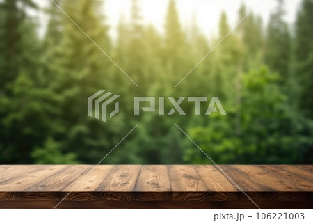 The empty wooden table top with blur background of boreal forest. Exuberant. 106221003