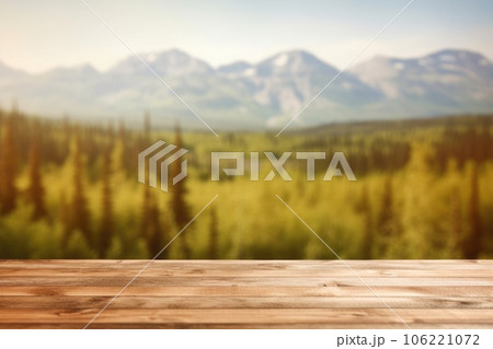 The empty wooden table top with blur background of Alaska nature. Exuberant. The empty wooden table top with blur background of Alaska nature. Exuberant. 106221072