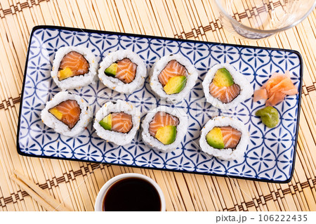 Tasty sushi california roll with salmon and avocado 106222435