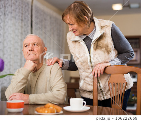 Woman asking for forgiveness from offended husband 106222669