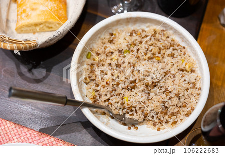 Popular dish of Oriental cuisine is rice with lentils 106222683