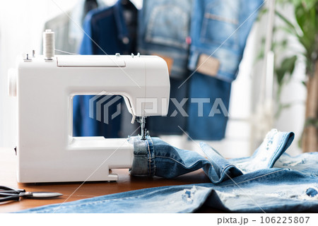 tailor working with jeans. 106225807
