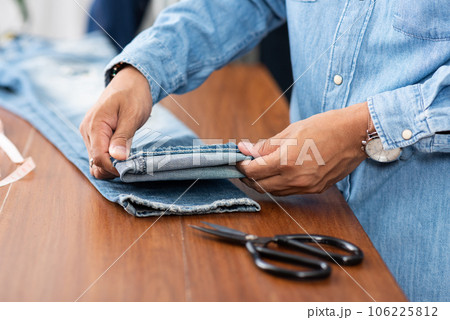 tailor working with jeans. tailor working with jeans. 106225812