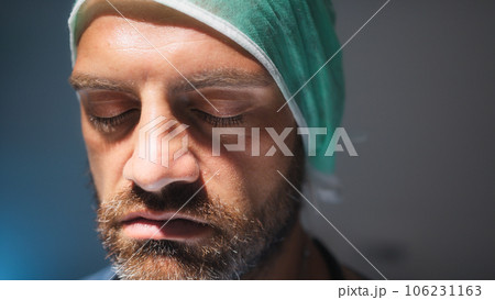 Burnout Tired doctor open eye after a long surgery work Burnout Tired doctor open eye after a long surgery work 106231163