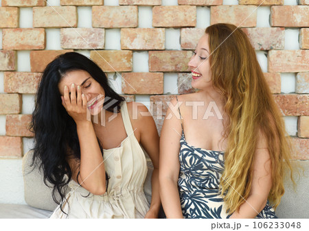 Russian beautiful blonde woman talking with her best friend Russian beautiful blonde woman talking with her best friend 106233048