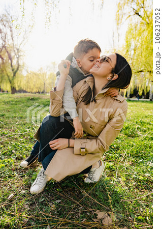 Single mother spending some time at the park with her little son 106237052