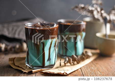 Signature iced chocolate mint drink in glass Signature iced chocolate mint drink in glass 106237678