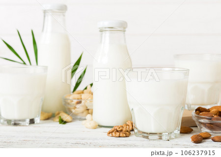 Set or collection of various vegan milk almond, cashew, on table background. Vegan plant based milk and ingredients, top view Set or collection of various vegan milk almond, cashew, on table background. Vegan plant based milk and ingredients, top view 106237915