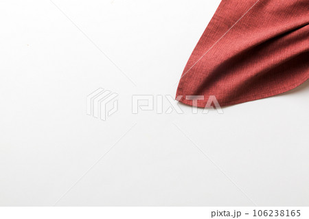 top view with red empty kitchen napkin isolated on table background. Folded cloth for mockup with copy space, Flat lay. Minimal style top view with red empty kitchen napkin isolated on table background. Folded cloth for mockup with copy space, Flat lay. Minimal style 106238165
