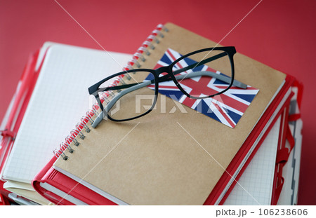 British language textbook and glasses are on table 106238606