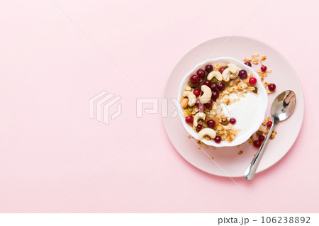 Healthy breakfast food with granola, yogurt, fruits and nuts. Dessert parfait with dried fruits for breakfast Healthy breakfast food with granola, yogurt, fruits and nuts. Dessert parfait with dried fruits for breakfast 106238892
