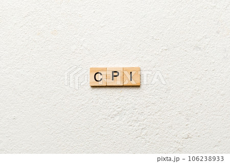 CPI word written on wood block. abbreviation consumer price index text on cement table for your desing, concept CPI word written on wood block. abbreviation consumer price index text on cement table for your desing, concept 106238933