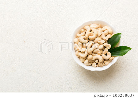 cashew nuts in wooden bowl on table background. top view. Space for text Healthy food 106239037