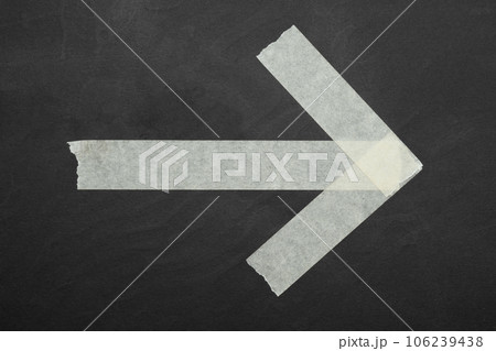 arrow ,close up of an adhesive tape 106239438