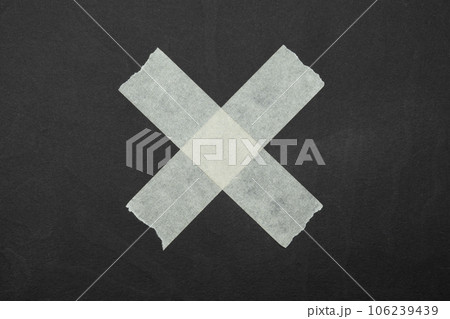 cross, close up of an adhesive tape cross, close up of an adhesive tape 106239439
