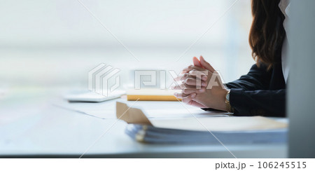 Close up clasped hands businesswomen negotiate at table, confrontation concept, negotiators conflict difficult job interview, hiring decision 106245515