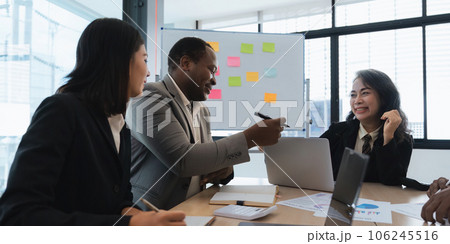 Businesspeople team ethnicity diversity is meeting for a project to establish and plan. Discussion of graphs and chart data analysis business finance graph and accounting concept 106245516