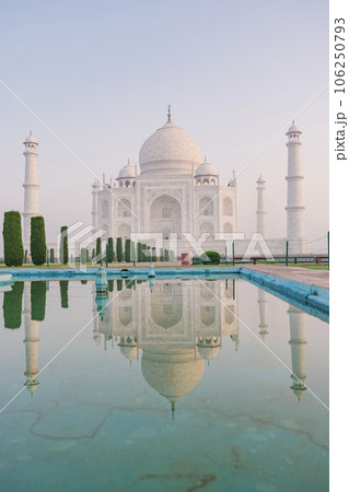 The Taj Mahal is an ivory-white marble mausoleum on the south bank of the Yamuna river in the Indian city of Agra, Uttar Pradesh, India. The Taj Mahal is an ivory-white marble mausoleum on the south bank of the Yamuna river in the Indian city of Agra, Uttar Pradesh, India. 106250793