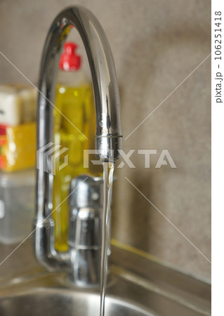 water pouring from a faucet tap slow motion water pouring from a faucet tap slow motion 106251418
