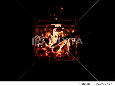 Close up picture of wood burning in a camp fire. Hot Red Flames. Taken in Nova Scotia, Canada Dark Mood Close up picture of wood burning in a camp fire. Hot Red Flames. Taken in Nova Scotia, Canada Dark Mood 106253737