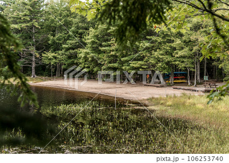 Canoe ride lending on river islands in morning mist at Kejimkujik National Park Designated Wilderness Nova Scotia Canada Canoe ride lending on river islands in morning mist at Kejimkujik National Park Designated Wilderness Nova Scotia Canada 106253740