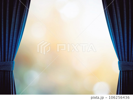 青のカーテンと輝くイメージ背景 106256436