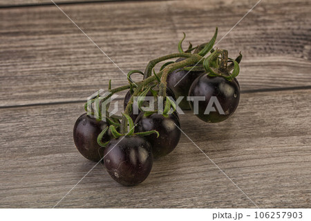 Ripe tasty black cherry tomato 106257903