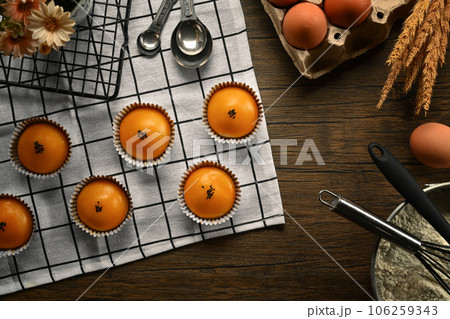 Traditional dessert for Chinese Mid-Autumn festival. Chinese pastry with stuffed salted yolk on wooden kitchen table Traditional dessert for Chinese Mid-Autumn festival. Chinese pastry with stuffed salted yolk on wooden kitchen table 106259343