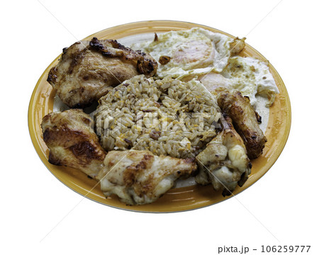 Homemade egg stir fried rice served with Grilled chicken and 2 Fried eggs in ceramic plate isolated on white background with clipping path. Homemade egg stir fried rice served with Grilled chicken and 2 Fried eggs in ceramic plate isolated on white background with clipping path. 106259777
