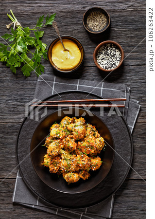 bang bang broccoli bites in bowl, top view 106263422