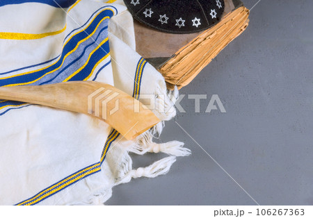 Jew religious symbols in synagogue shofar jewish holiday prayer book shawl tallit kippah an holly days Jew religious symbols in synagogue shofar jewish holiday prayer book shawl tallit kippah an holly days 106267363